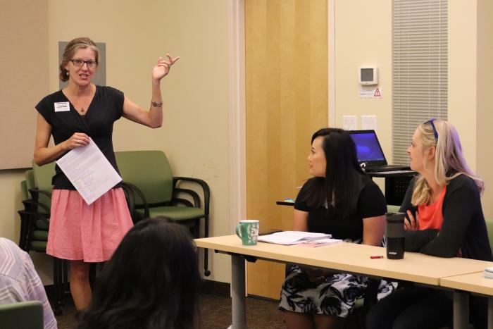 Debbie leads a panel discussion.