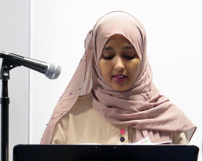 Journeys author reads aloud in front of audience