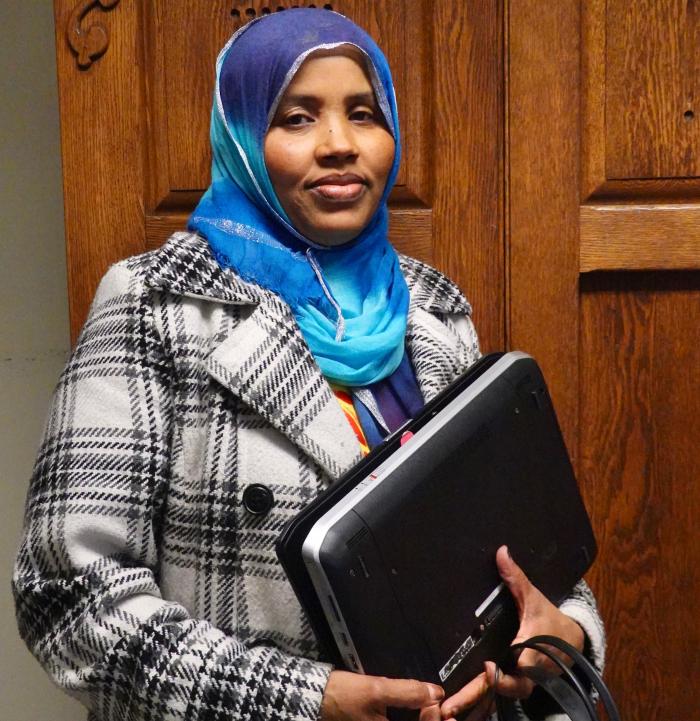Ramsey County resident with laptop provided through the TechPak initiative