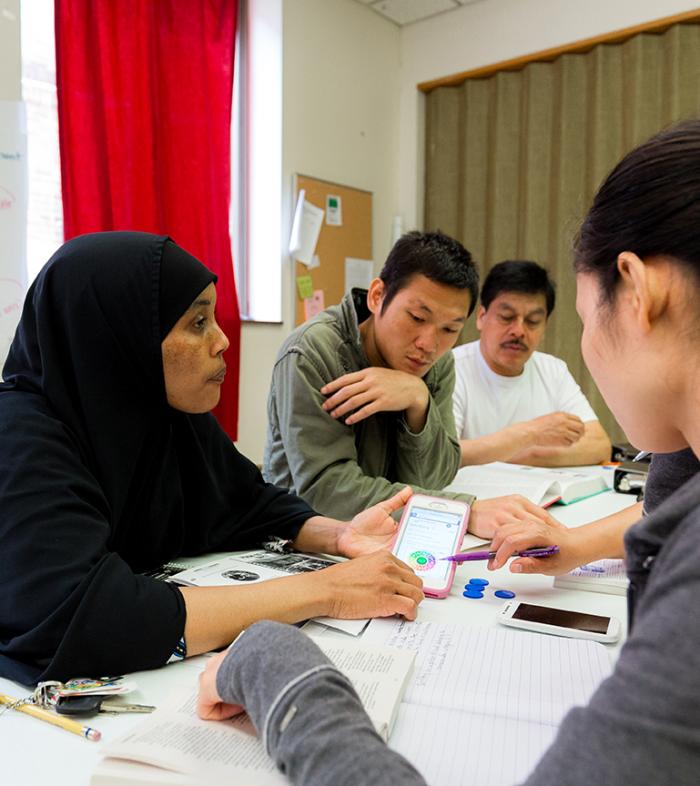 Learners do a classroom activity using their smartphones