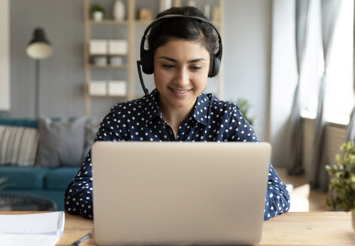 Person sits in front of a computer.