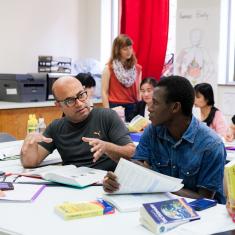 Volunteer explaining concept to students