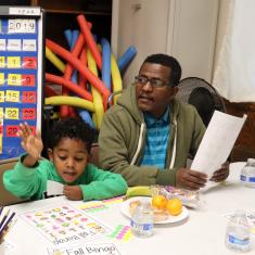 Father and son playing bingo