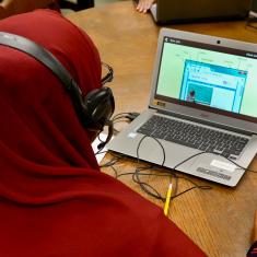 learner with laptop and headphones