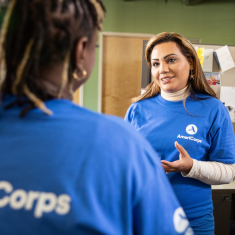 Two AmeriCorps members talking