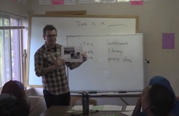 Teacher standing in front of a whiteboard
