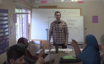 Teacher standing in front of a whiteboard