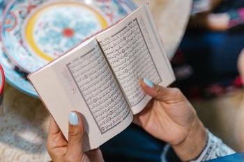 woman holding qur'an