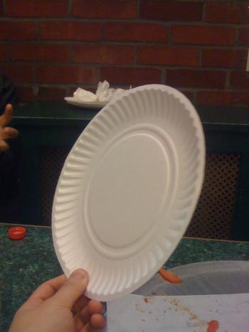 hand holding a paper plate