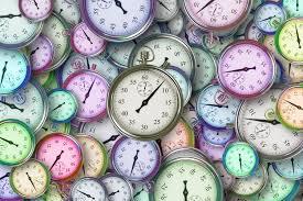 a pile of pastel colored stopwatches