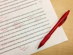 edited paper with red pen