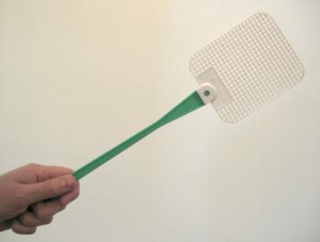 hand holding a green and white flyswatter against a white background