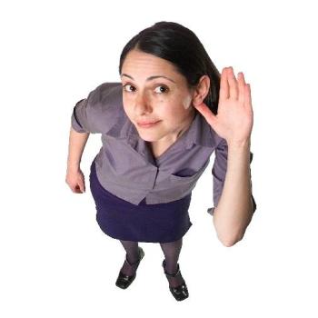 standing woman holding a hand to her ear