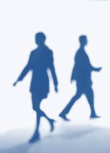 two figures walking