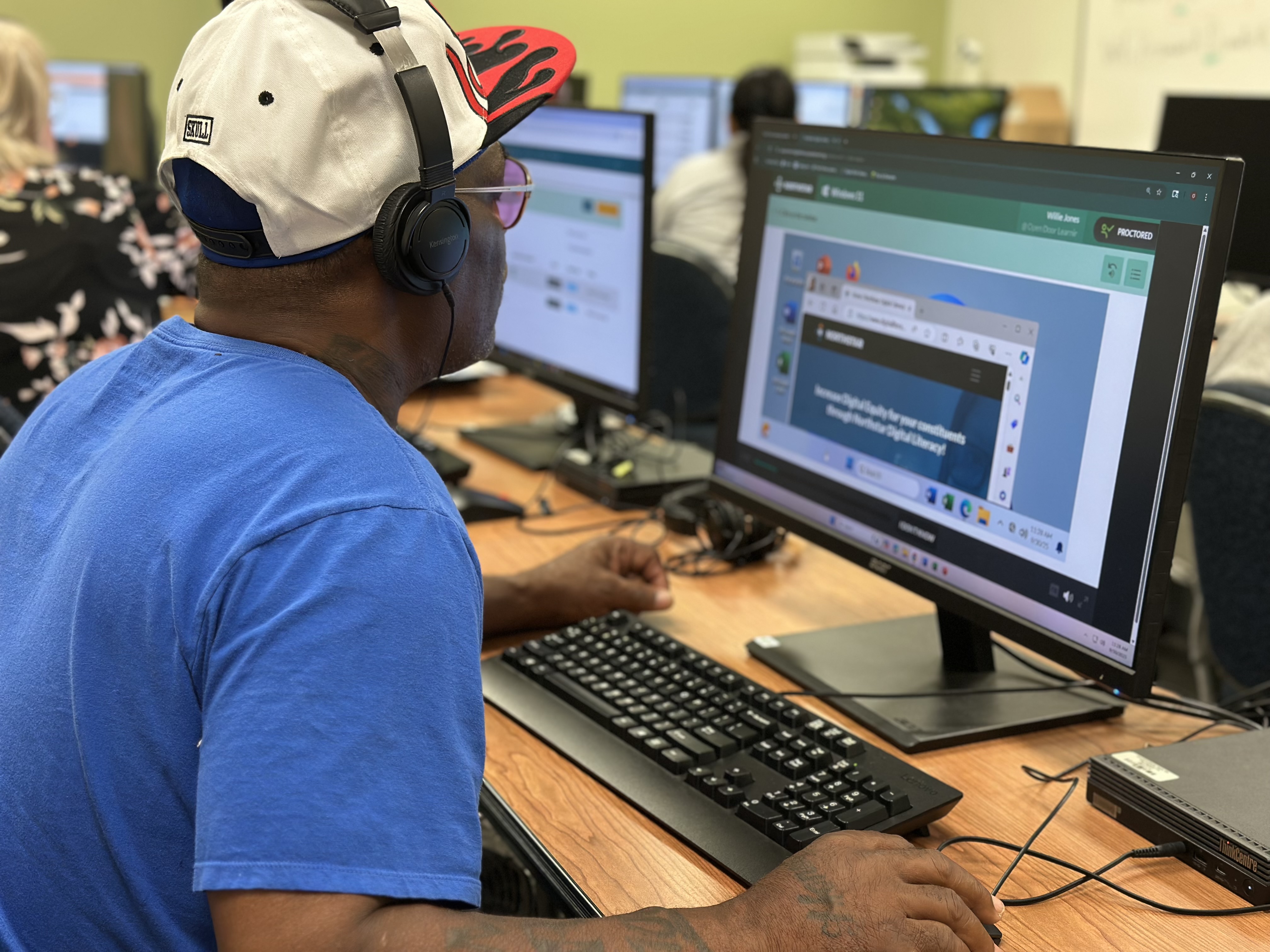 Willie Jones sits at a computer taking a Northstar Digital Literacy Assessment