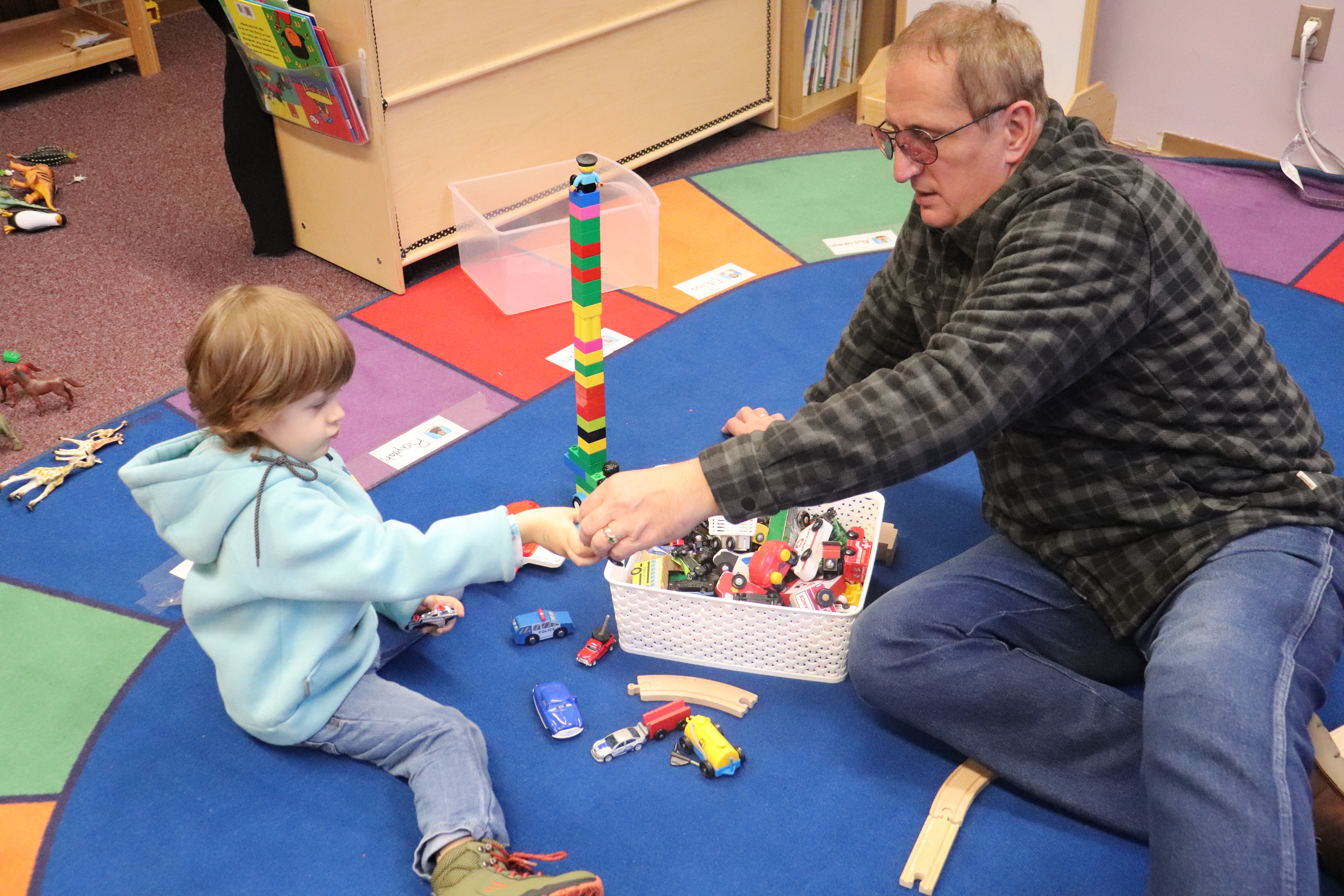 Ivan plays legos with his father, Sergei, in the Open Door preschool.